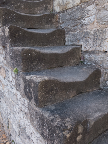 These steps, on Pont Valentré, have seen some feet. I guess in 800 years some wear can be expected.